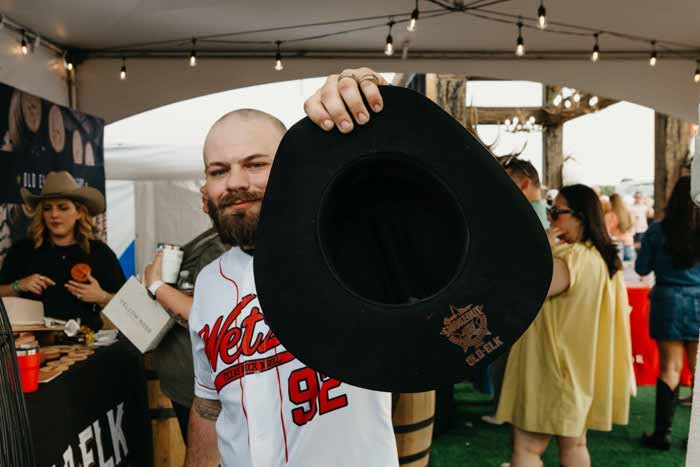 Guest showing a finished custom branded cowboy hat