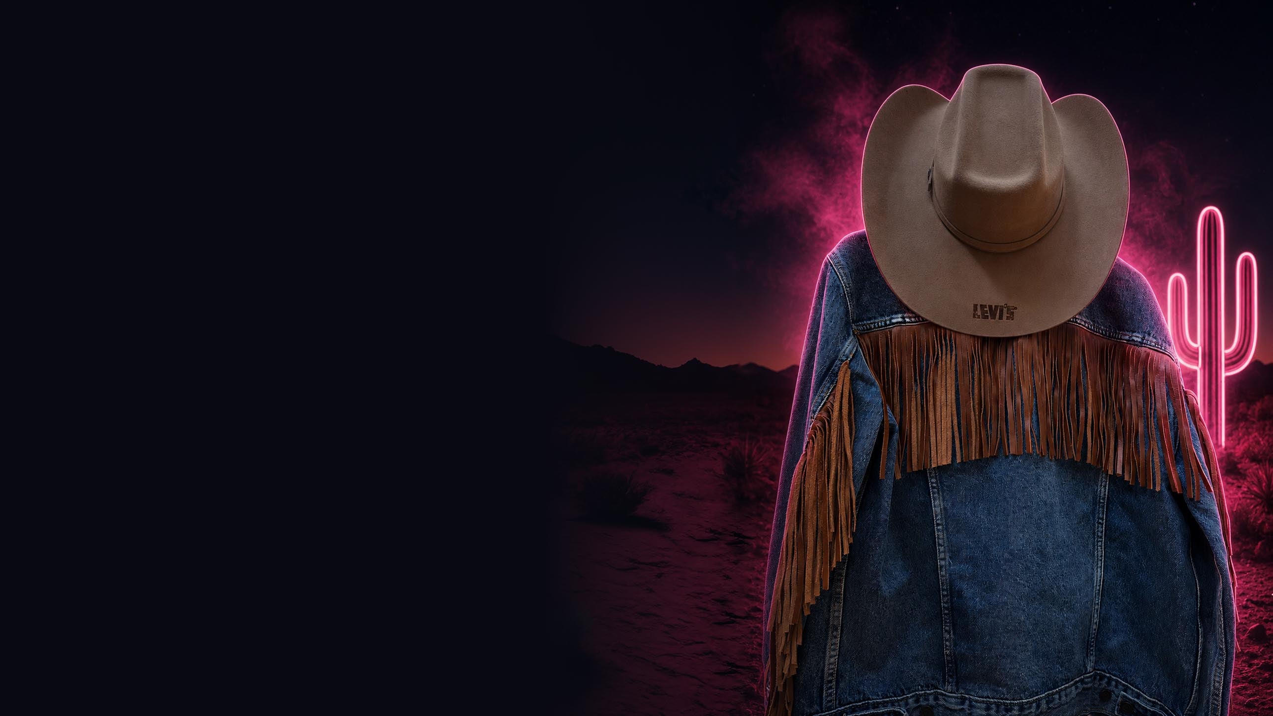 Branded cowboy hat and fringed western jacket in a neon desert